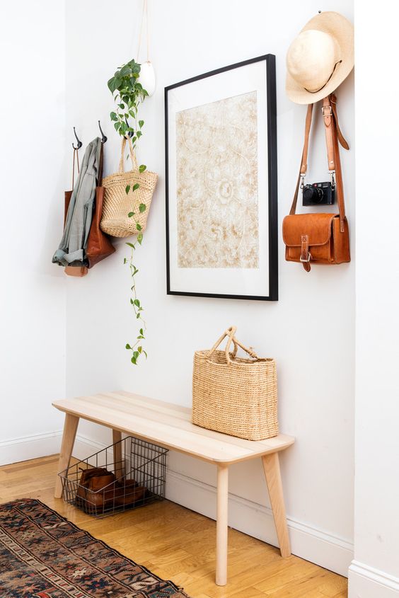 A Boho Entryway With Simple Wooden Bench