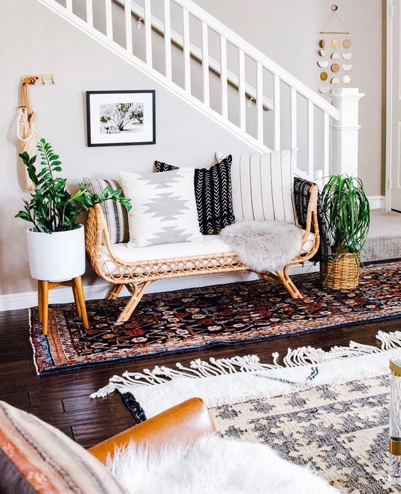A Gorgeous Boho Entry With Boho Rugs, A Rattan Bench