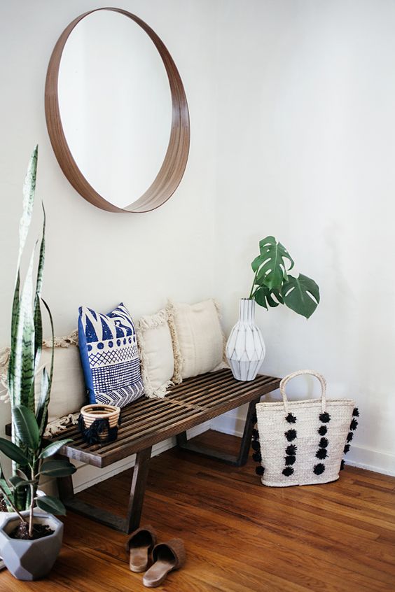 A Warm And Chic Bohemian Entryway With Wooden Bench