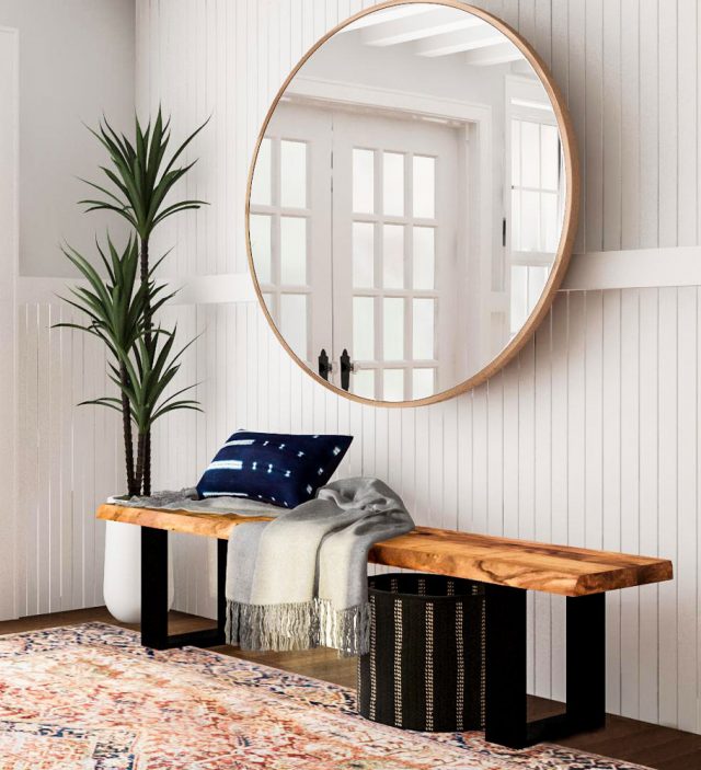 A Bohemian Style Entryway With A Large Scale Mirror